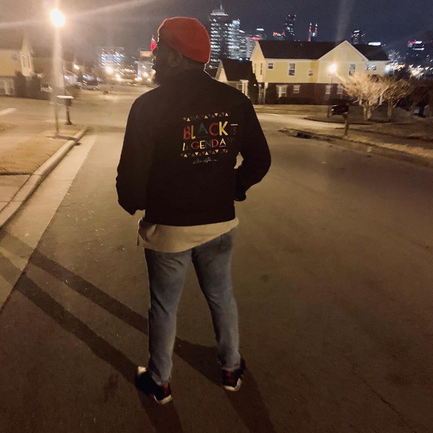 Joe Major in a Live Above 'Black Is Legendary' hoodie